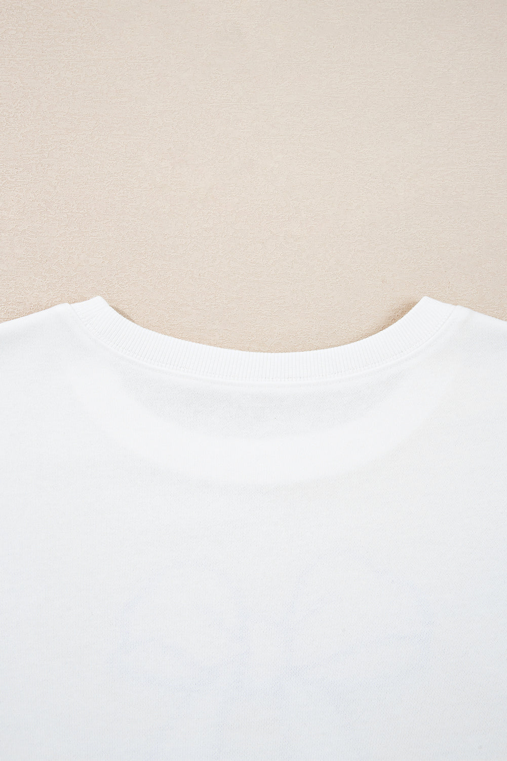 Sudadera beige con estampado de lazo grande y hombros caídos en talla grande