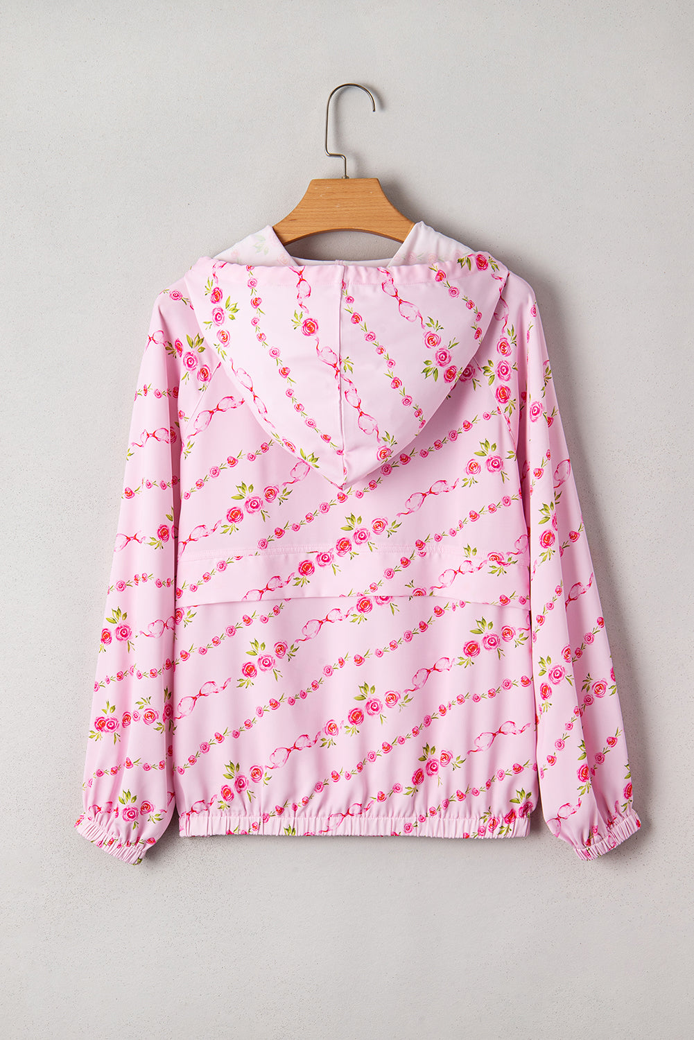 Sudadera con capucha y cordón ajustable con bolsillo tipo canguro y media cremallera con estampado floral rosa