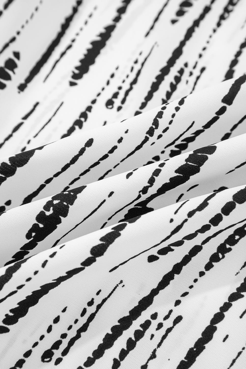 Chemisier blanc à manches longues et col en V à imprimé abstrait