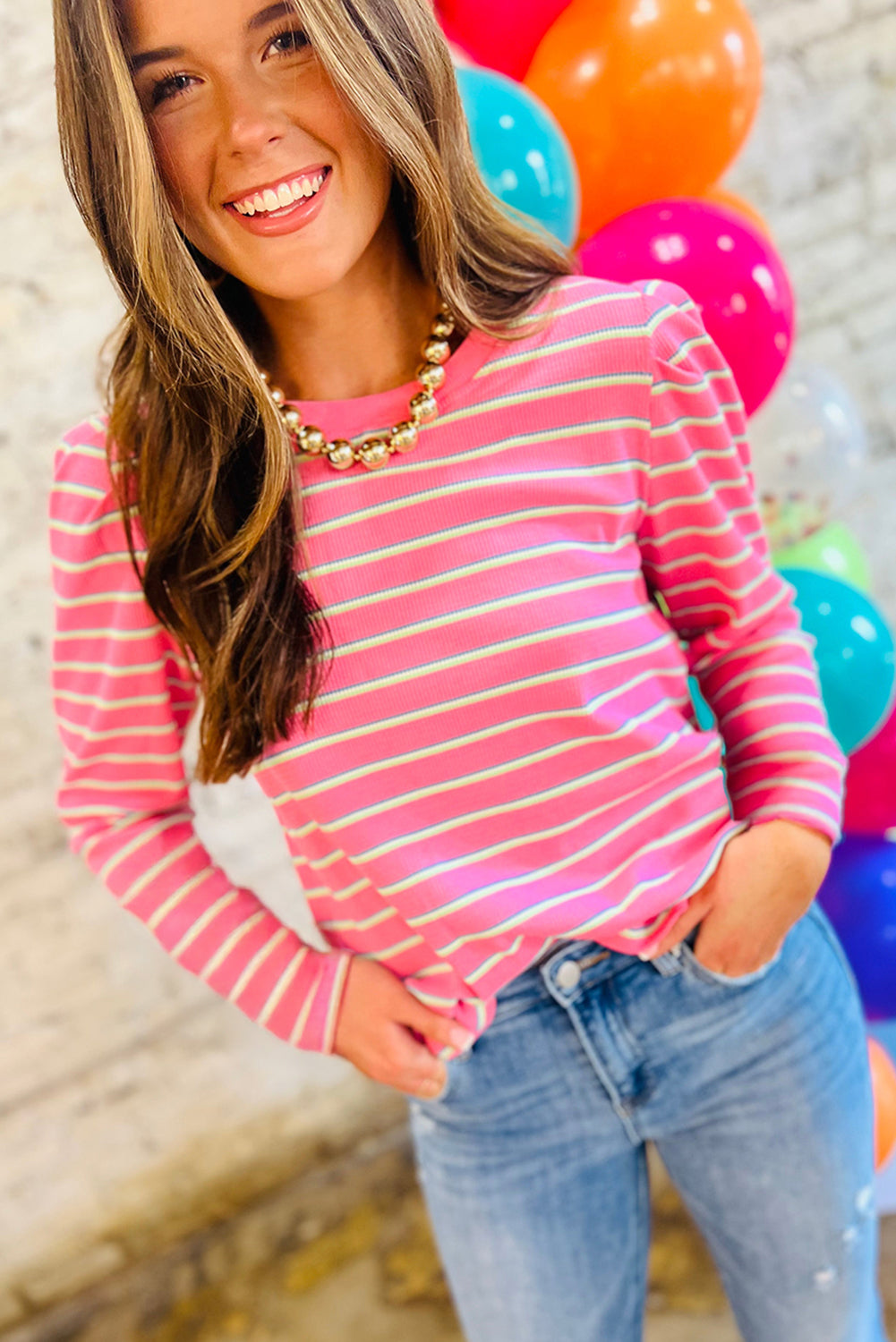 Top de cuello redondo con mangas abullonadas y tejido texturizado a rayas rosas