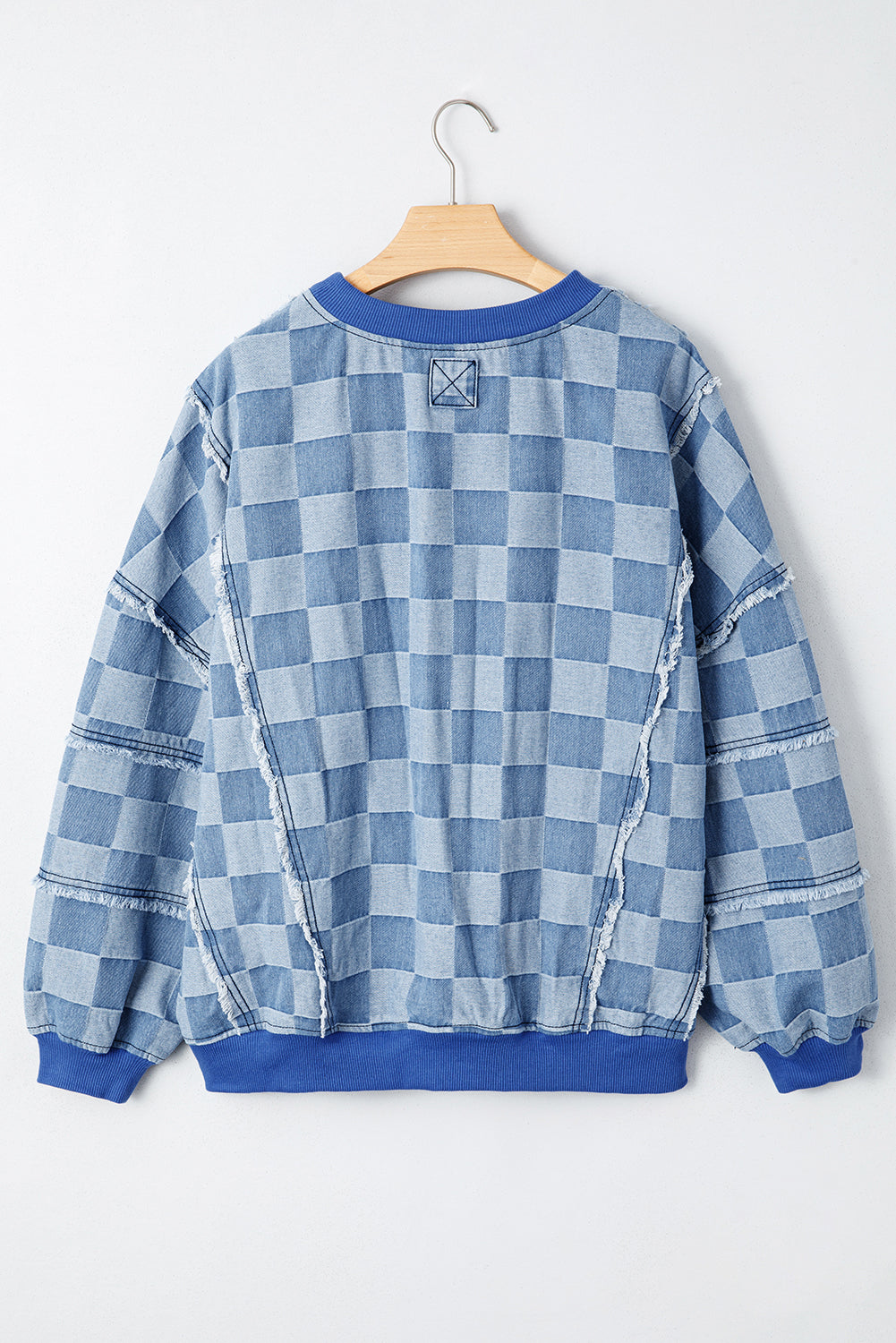 Pull oversize en denim bleu ciel à détails bruts et à motif damier