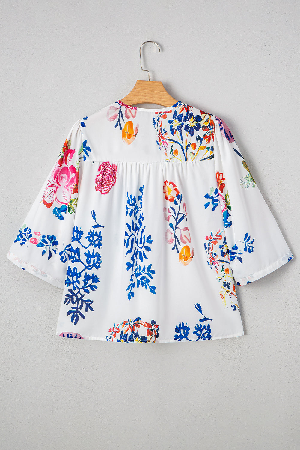 Chemisier blanc à col en V et franges style bohème floral