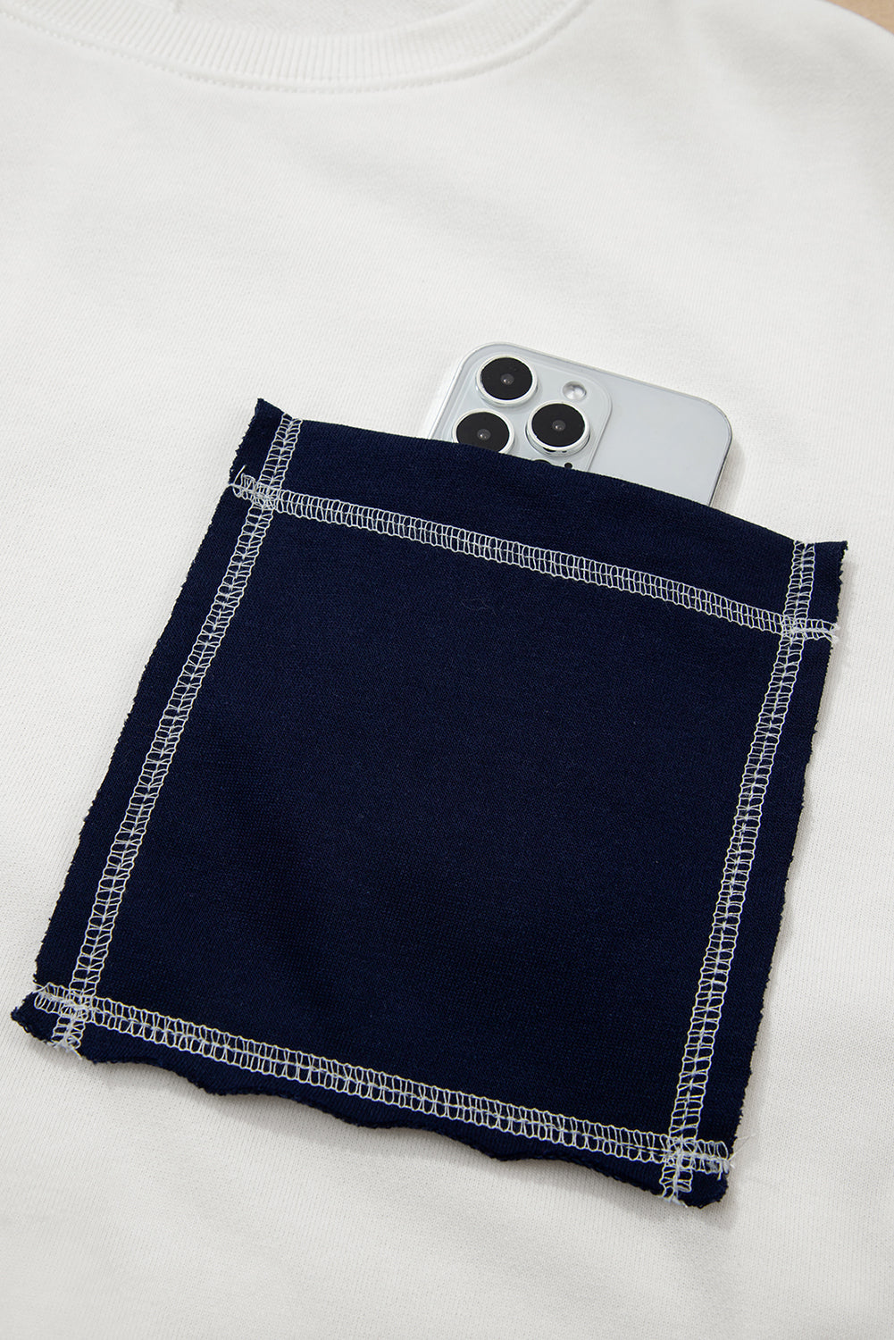 Sweat-shirt col rond côtelé patchwork en denim blanc