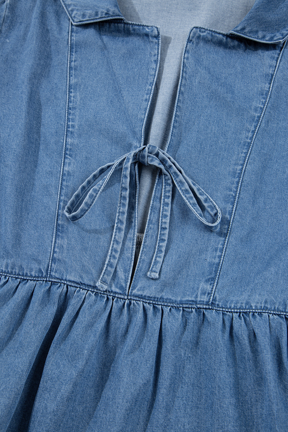 Top peplum con mangas globo y cuello solapa de mezclilla azul crepúsculo