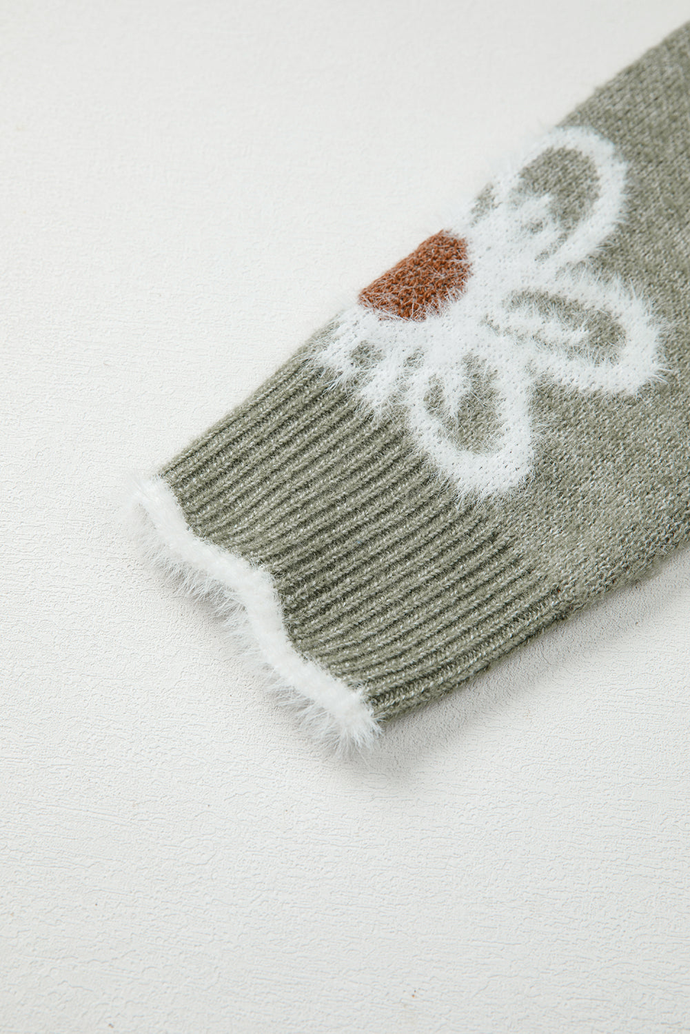 Suéter de cuello en V con ribete floral y jacquard de fibra de mar