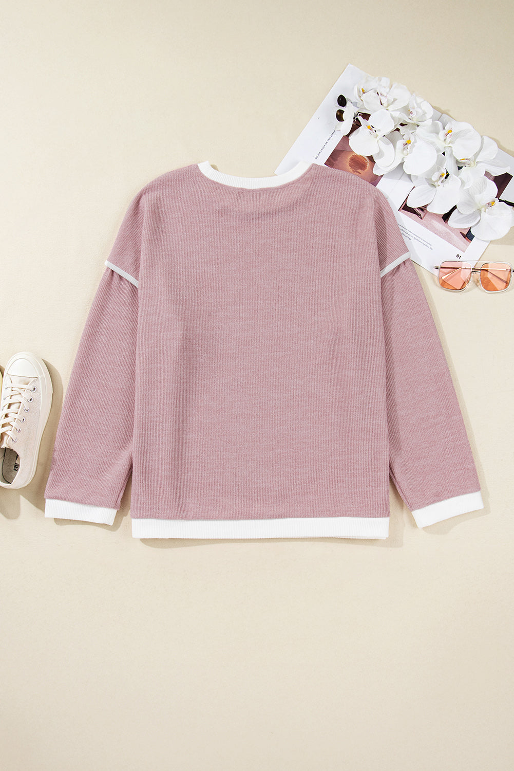 Top de punto con hombros caídos y ribete en contraste rosa claro, talla grande