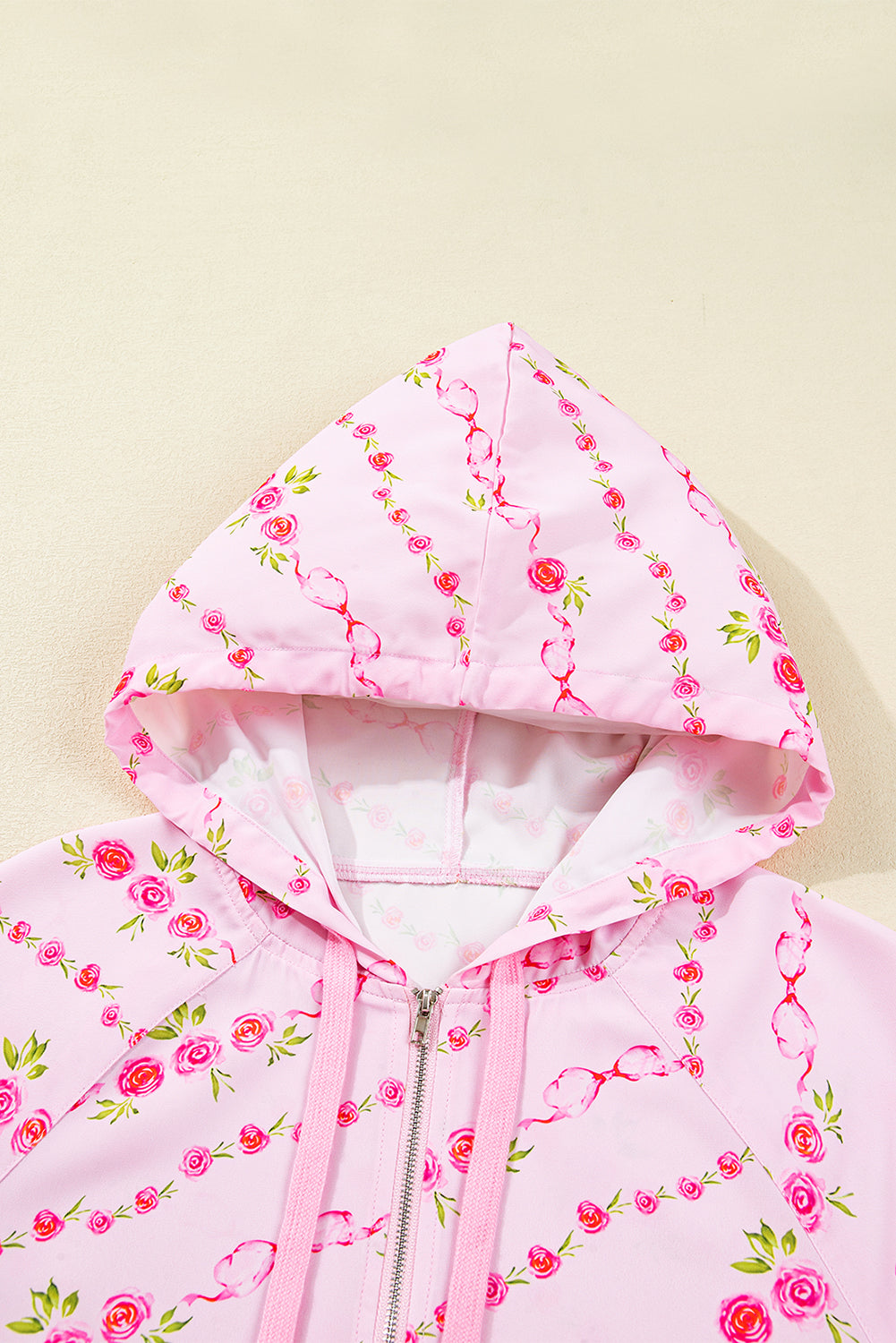 Sudadera con capucha y cordón ajustable con bolsillo tipo canguro y media cremallera con estampado floral rosa
