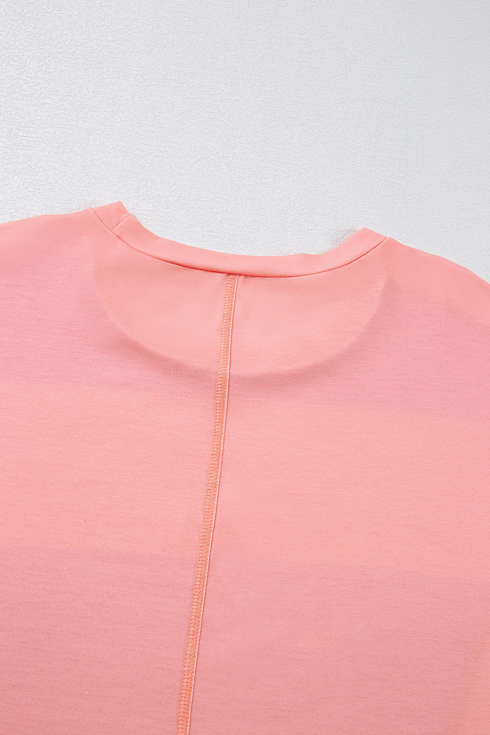 Top de cuello redondo con mangas caídas y bloques de color verde claro